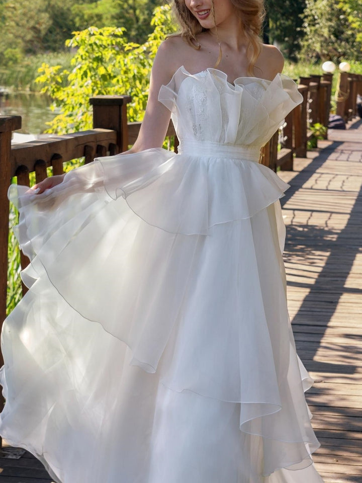 A-Line/Princess Strapless sleeveless Floor-Length Wedding Dress with Ruffles
