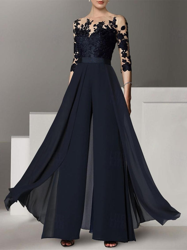 A black chiffon A-line/princess silhouette cocktail pantsuit with a jewel neckline, 3/4 length sleeves, and applique embellishments.